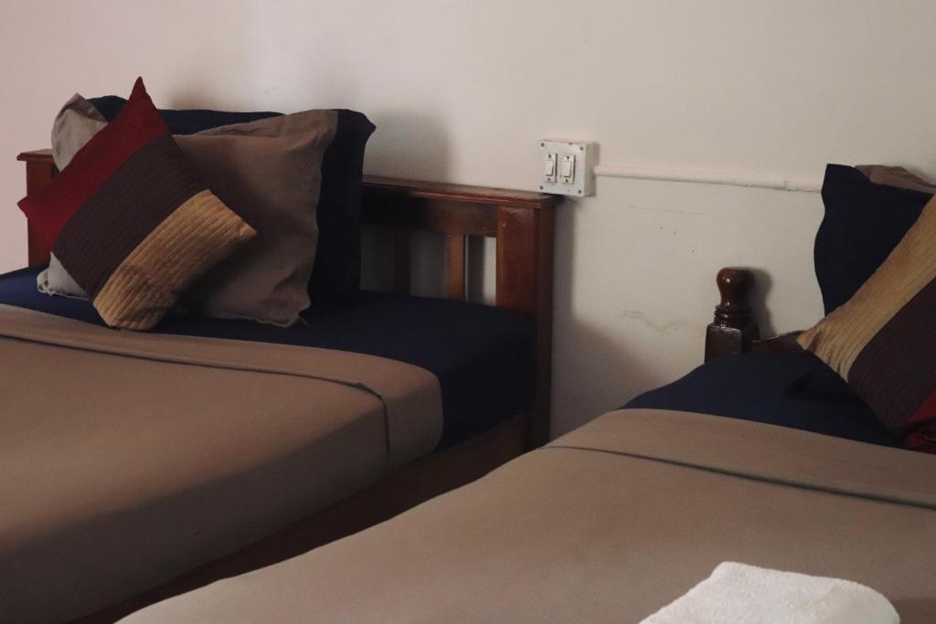 Postel nebo postele na pokoji v ubytování Paradise Inn Beach Resort