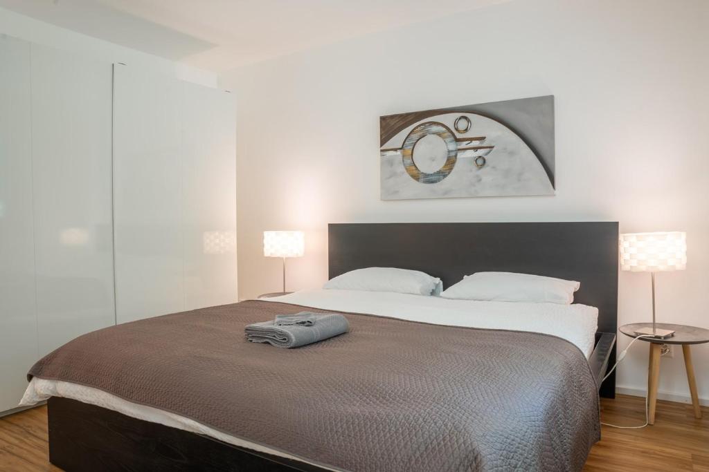 Voodi või voodid majutusasutuse BASELiving Apartment - St Jakob, near ESC - Bahnhof SBB toas