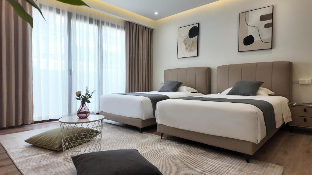 Postel nebo postele na pokoji v ubytování CC LUX Suites