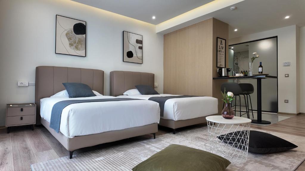 Postel nebo postele na pokoji v ubytování CC LUX Suites