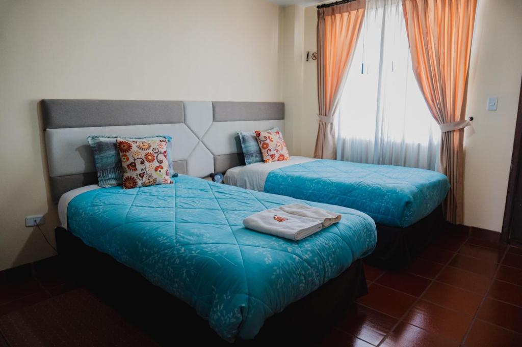 Postel nebo postele na pokoji v ubytování Hotel Casa Kolping Quito
