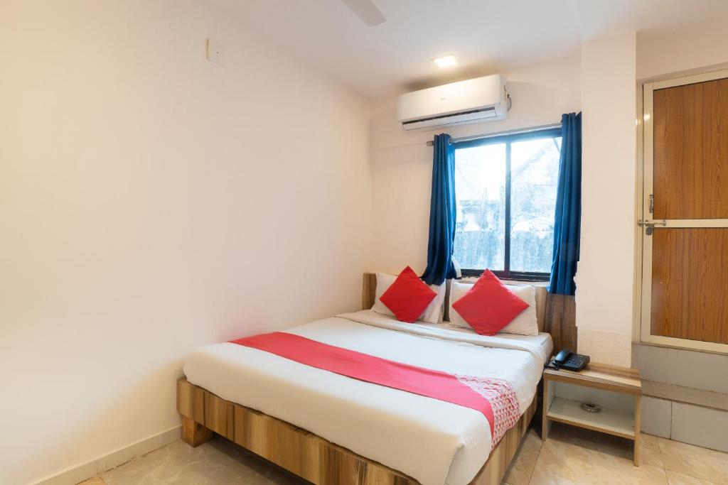 Postel nebo postele na pokoji v ubytování Hotel O Swell
