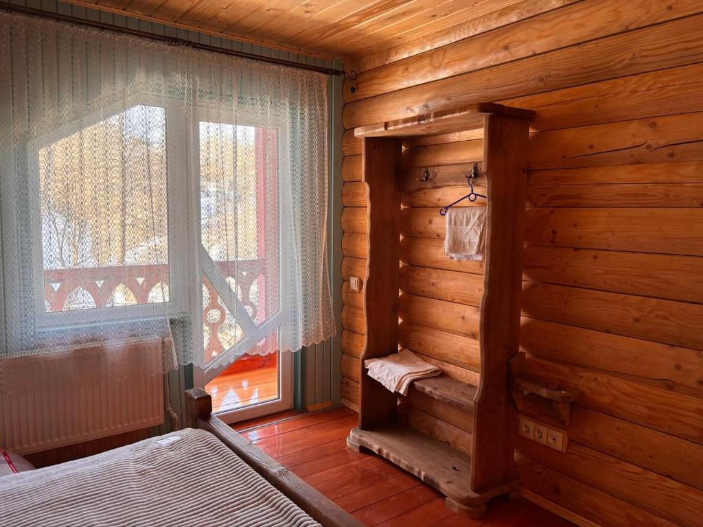 Postel nebo postele na pokoji v ubytování Садиба Кичера