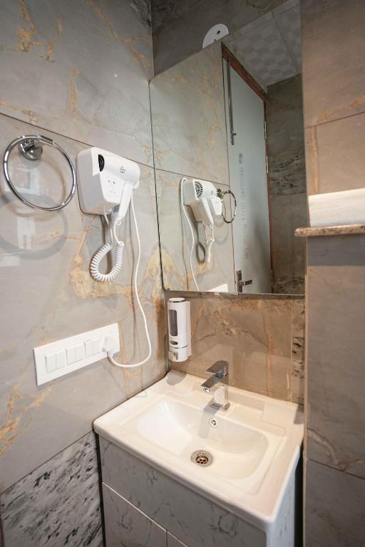 Koupelna v ubytování Atithi House