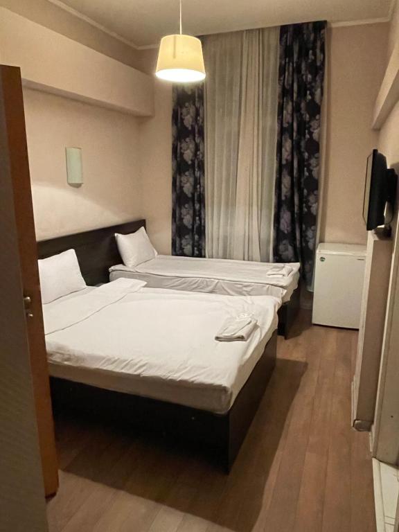 Postel nebo postele na pokoji v ubytování Hotel Tasty Tbilisi