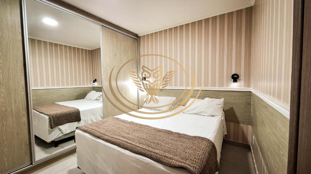 Postel nebo postele na pokoji v ubytování Coruja Imob - Flat Crystal Place
