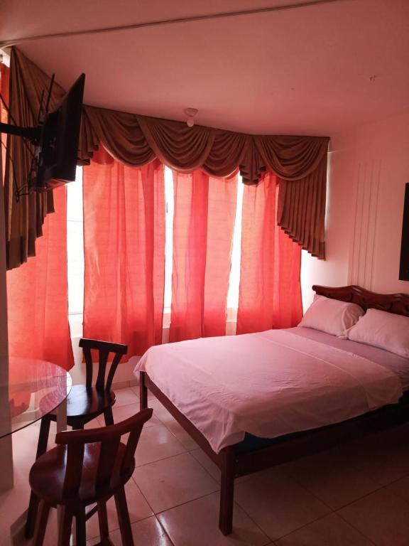 Postel nebo postele na pokoji v ubytování Hotel Rumbo al Sol