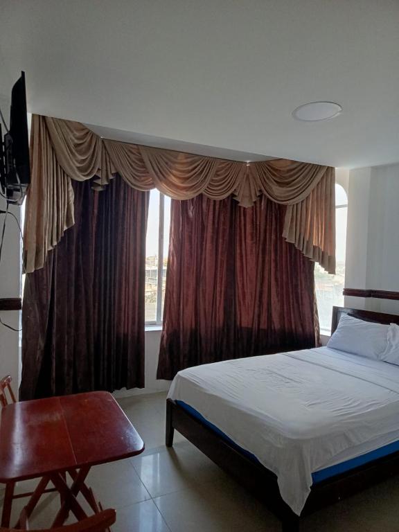 Postel nebo postele na pokoji v ubytování Hotel Rumbo al Sol