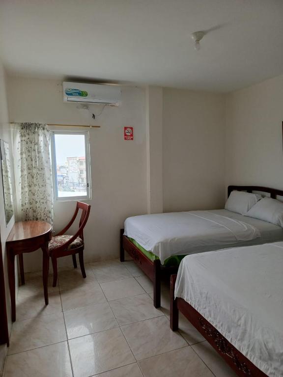 Postel nebo postele na pokoji v ubytování Hotel Rumbo al Sol