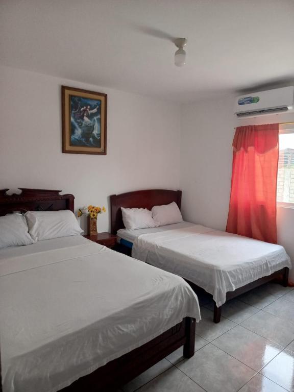 Postel nebo postele na pokoji v ubytování Hotel Rumbo al Sol