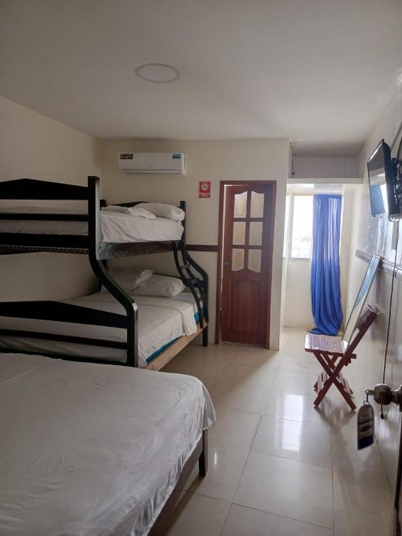 Postel nebo postele na pokoji v ubytování Hotel Rumbo al Sol