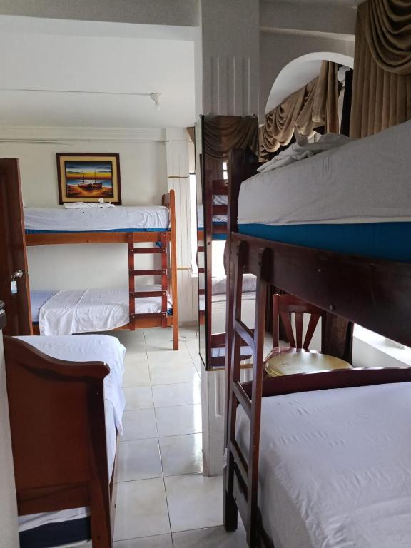 Postel nebo postele na pokoji v ubytování Hotel Rumbo al Sol