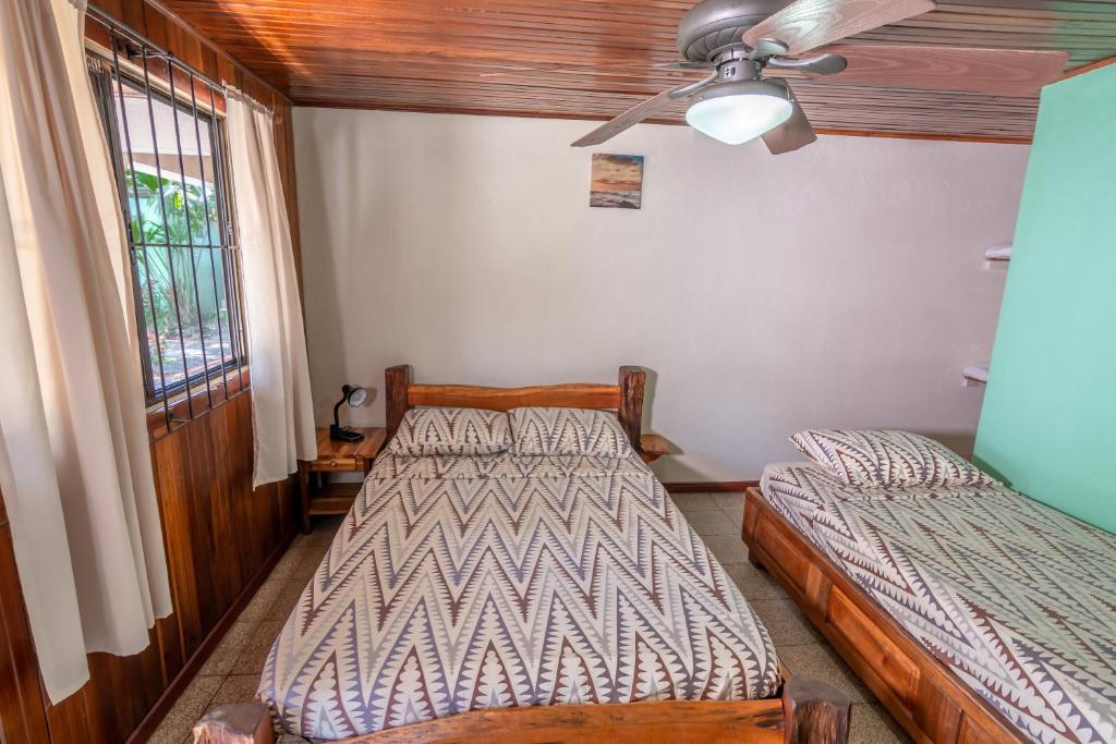 Postel nebo postele na pokoji v ubytování Cabinas Arrecife