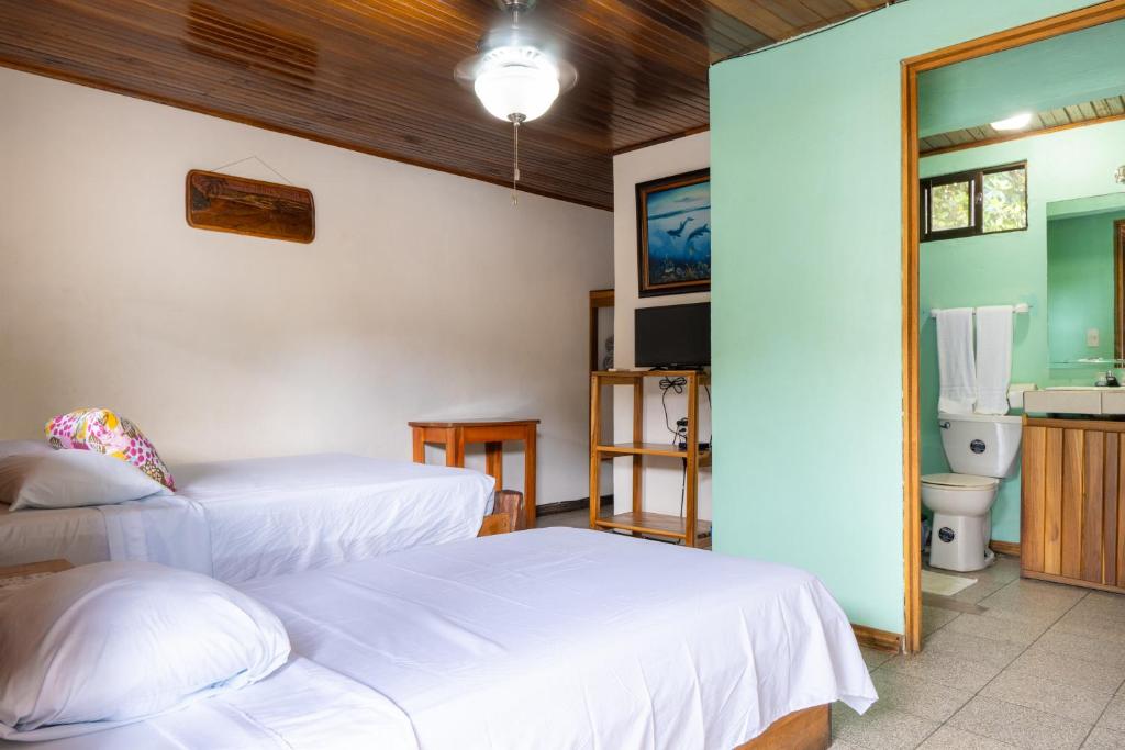 Postel nebo postele na pokoji v ubytování Cabinas Arrecife