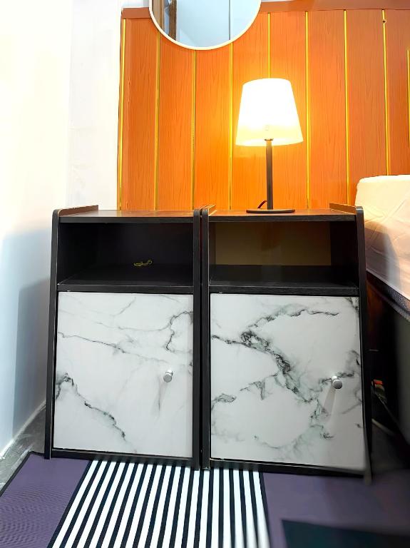 Postel nebo postele na pokoji v ubytování Jogja Day Inn