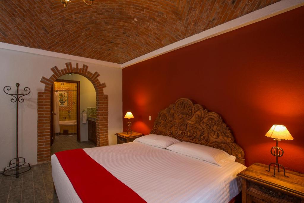 Postel nebo postele na pokoji v ubytování Atotonilco Hotel & Club