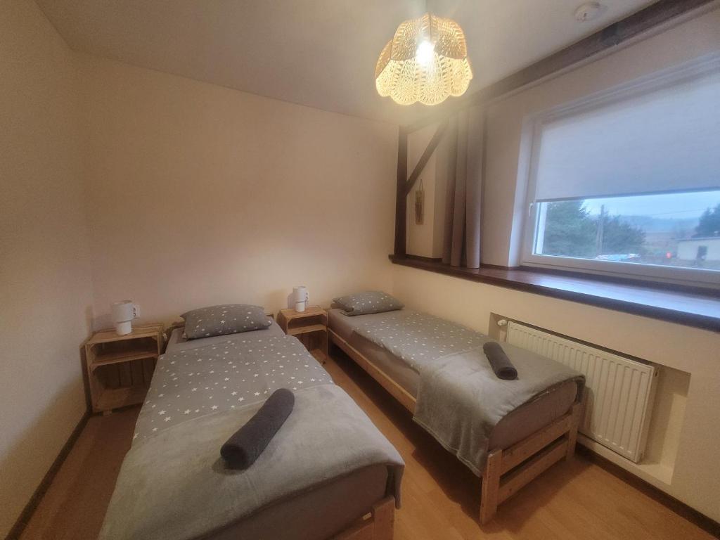 Posteľ alebo postele v izbe v ubytovaní Agroturystyka Sielska Kraina