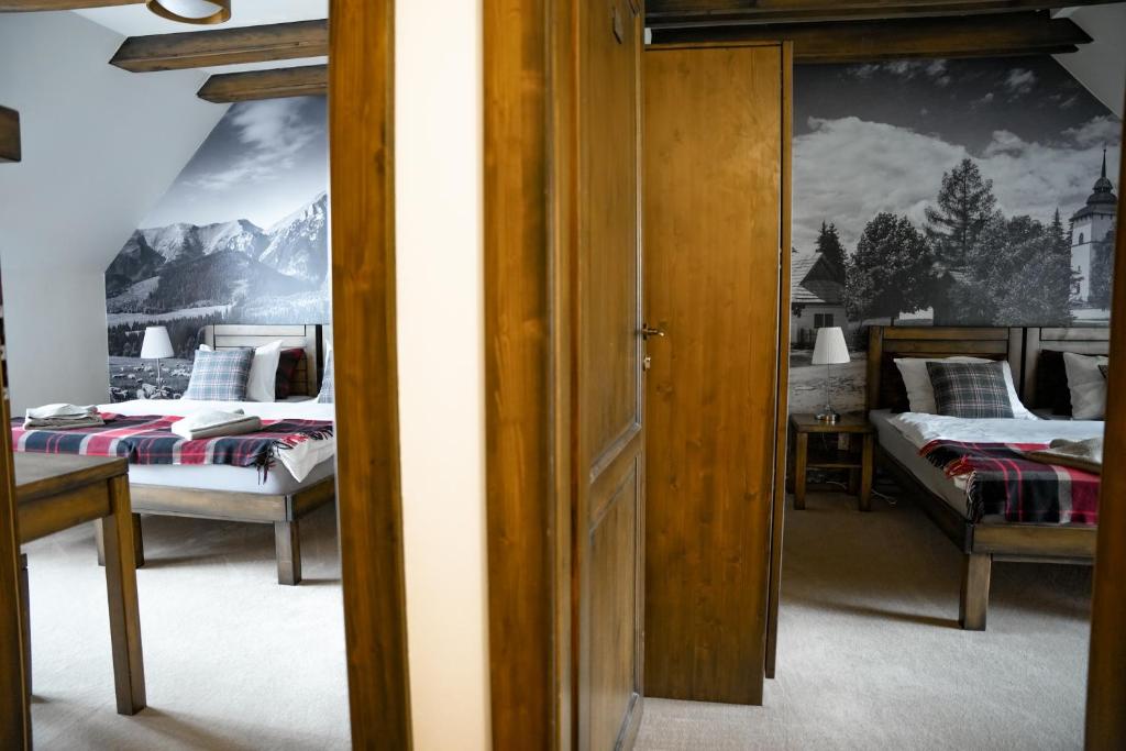 Postel nebo postele na pokoji v ubytování Family apartment in Tatranska Lomnica