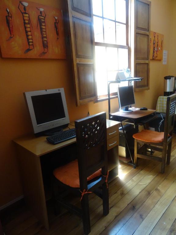 TV a/nebo společenská místnost v ubytování Hostal del Piamonte