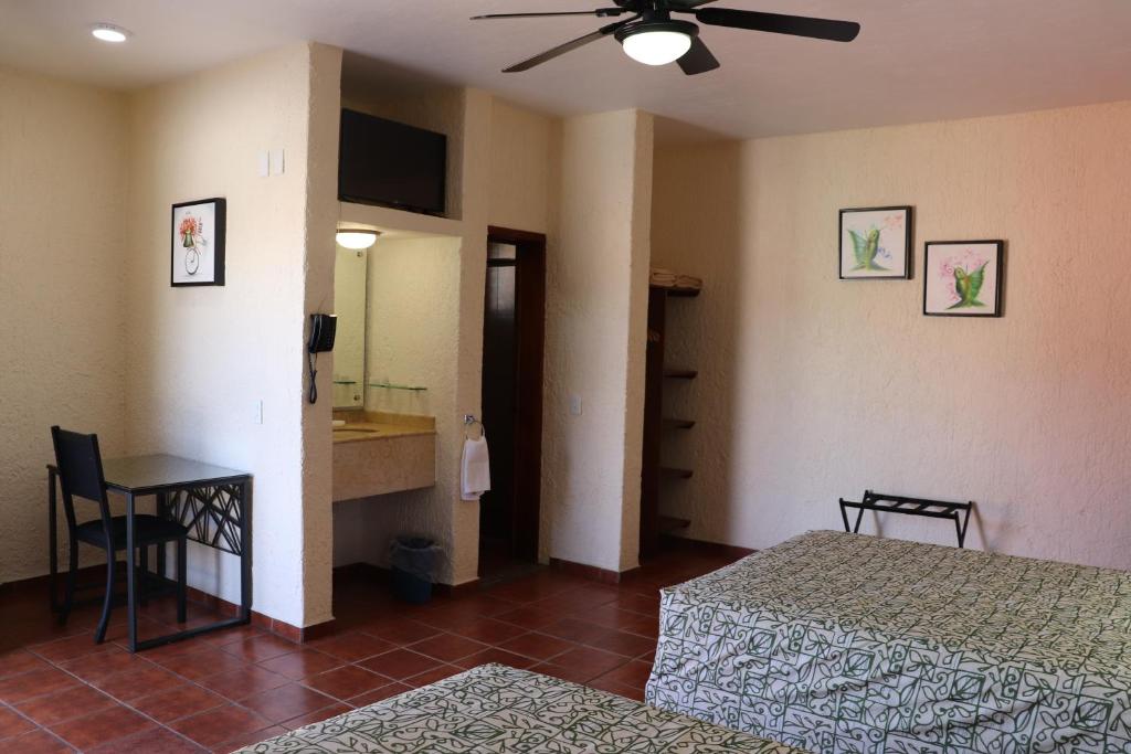 Postel nebo postele na pokoji v ubytování HOTEL CASA DE LAS PALOMAS