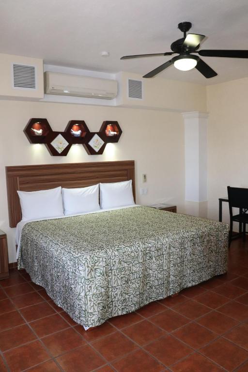 Postel nebo postele na pokoji v ubytování HOTEL CASA DE LAS PALOMAS