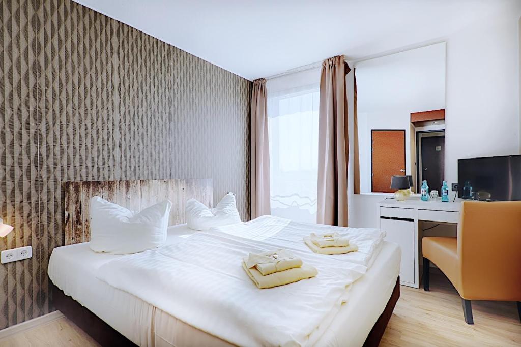 REGIOHOTEL Leipzig West - #Frühstücksbuffet #TopPreisLeistung #FreeParking #Wallbox - Quadruple Room