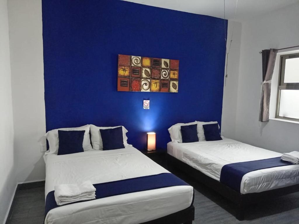 Postel nebo postele na pokoji v ubytování Hotel Gandag