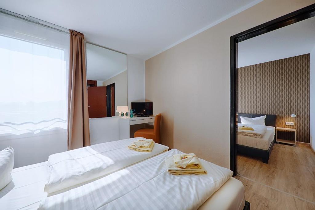 REGIOHOTEL Leipzig West - #Frühstücksbuffet #TopPreisLeistung #FreeParking #Wallbox - Family Room