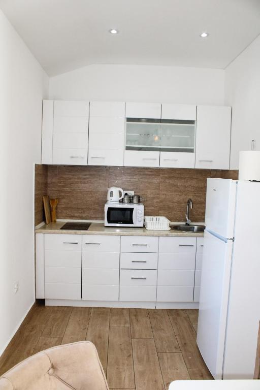 Kuchyň nebo kuchyňský kout v ubytování Apartment Stojanovic