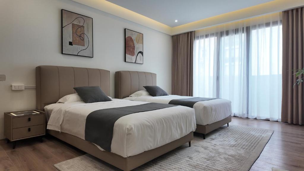Postel nebo postele na pokoji v ubytování CC LUX Suites