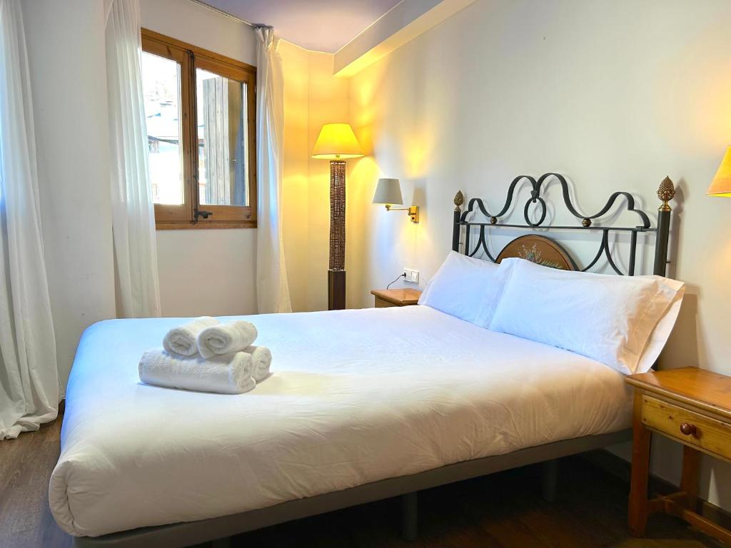 Voodi või voodid majutusasutuse La Posada d'Àneu by RdA Hotels toas