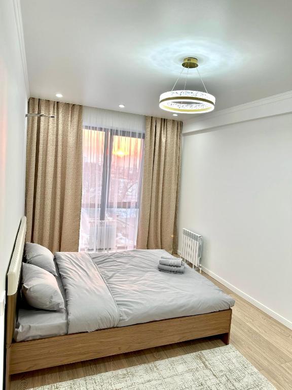 Postel nebo postele na pokoji v ubytování Airport Buta Legacy