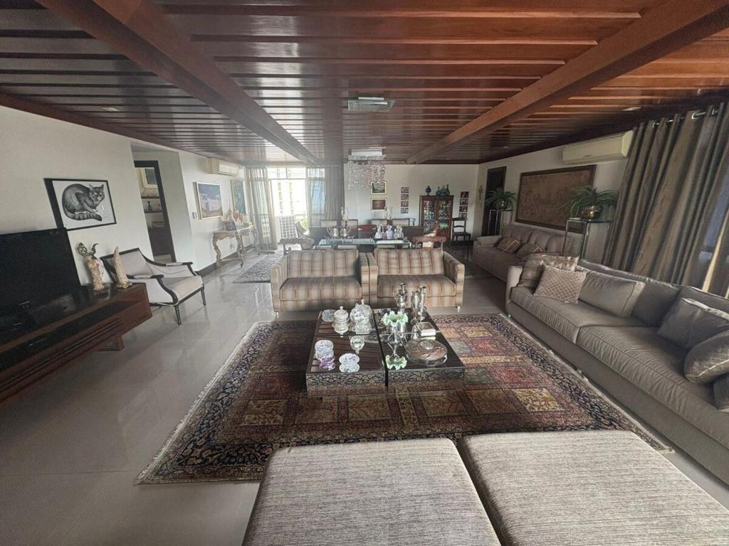 a large living room with couches and a table at COP 30 - Apartamento Amplo in Belém