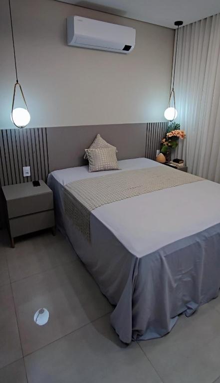 Ένα ή περισσότερα κρεβάτια σε δωμάτιο στο Linda casa com piscina