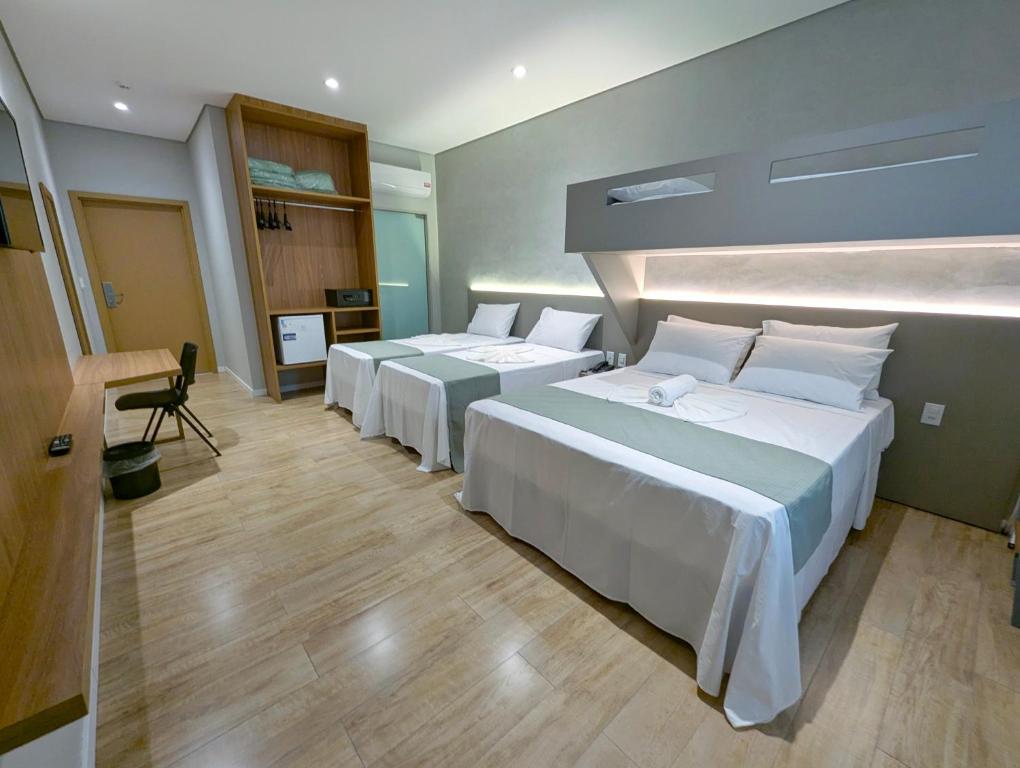 Postel nebo postele na pokoji v ubytování Hotel Jardim Iracema