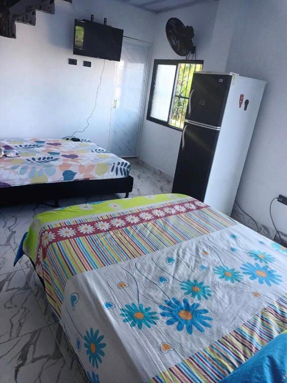 Postel nebo postele na pokoji v ubytování Casa Del Árbol
