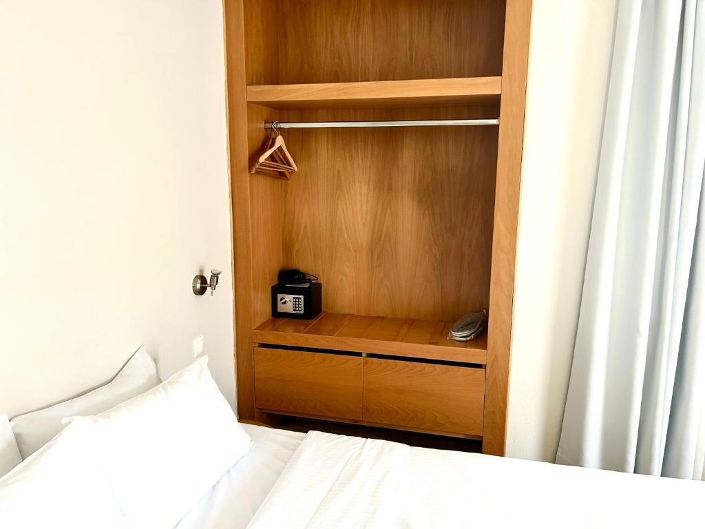 Postel nebo postele na pokoji v ubytování Loriet Hotel