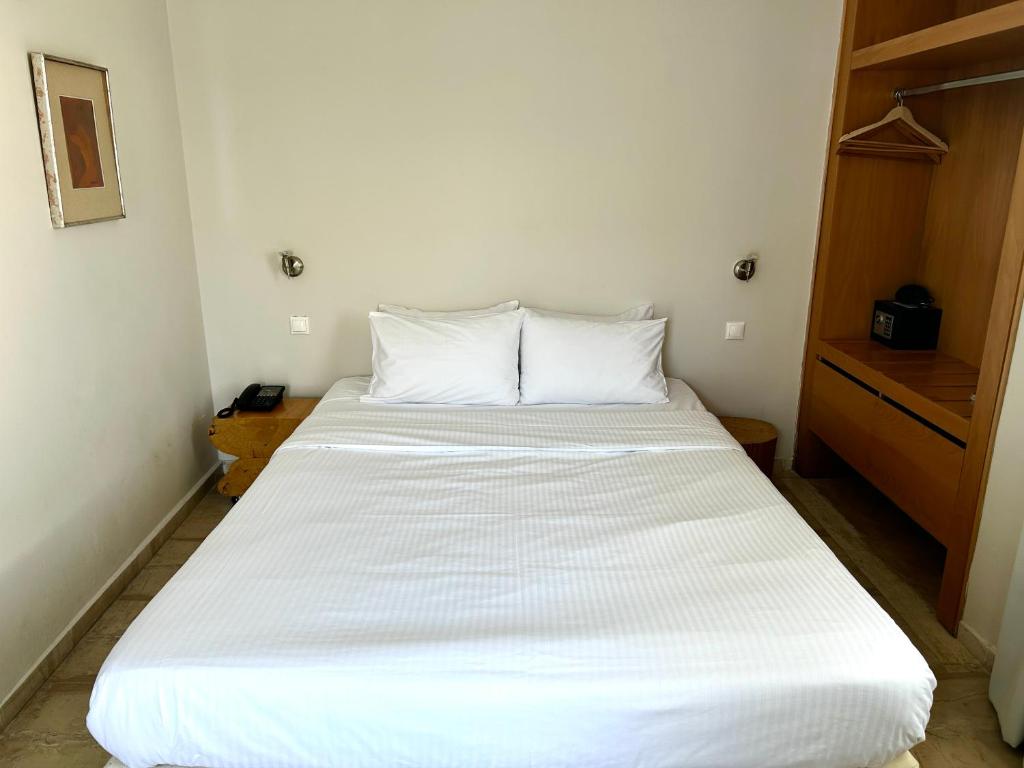 Postel nebo postele na pokoji v ubytování Loriet Hotel