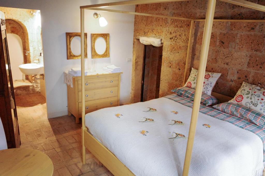 Postel nebo postele na pokoji v ubytování Case di Civita