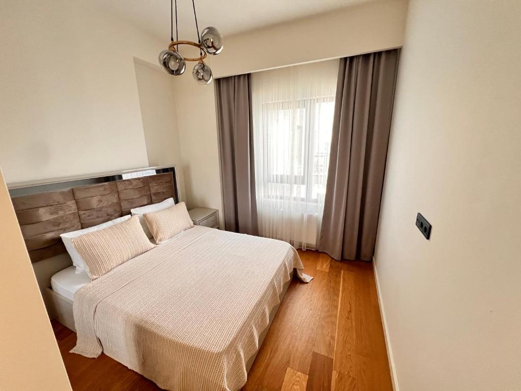 Postel nebo postele na pokoji v ubytování Divan Residence - Güneşli Near Ataköy Metro Station