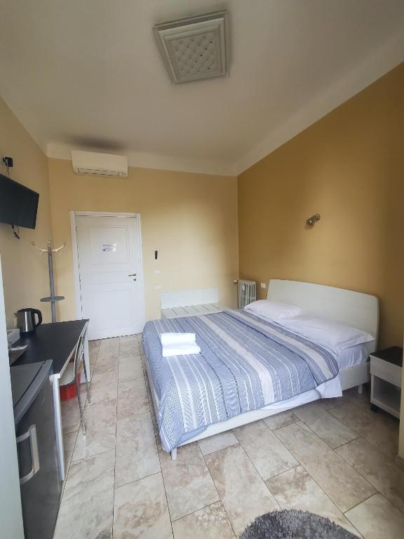 Łóżko lub łóżka w pokoju w obiekcie Hotel Emmy