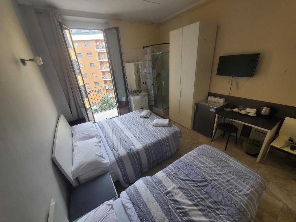 Łóżko lub łóżka w pokoju w obiekcie Hotel Emmy
