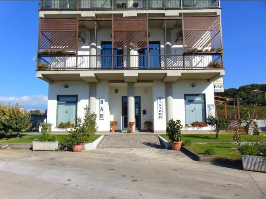 a building with a balcony on top of it at B&B FR House Affittacamere Colleferro in Colleferro