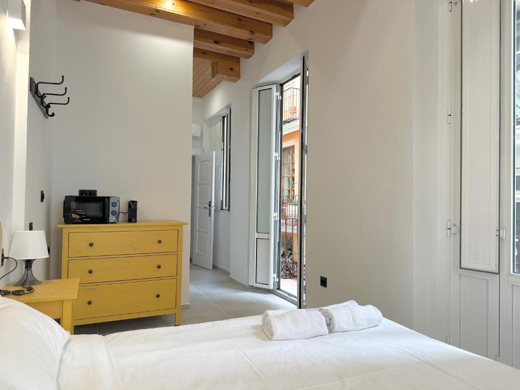 Postel nebo postele na pokoji v ubytování Mercat Suites