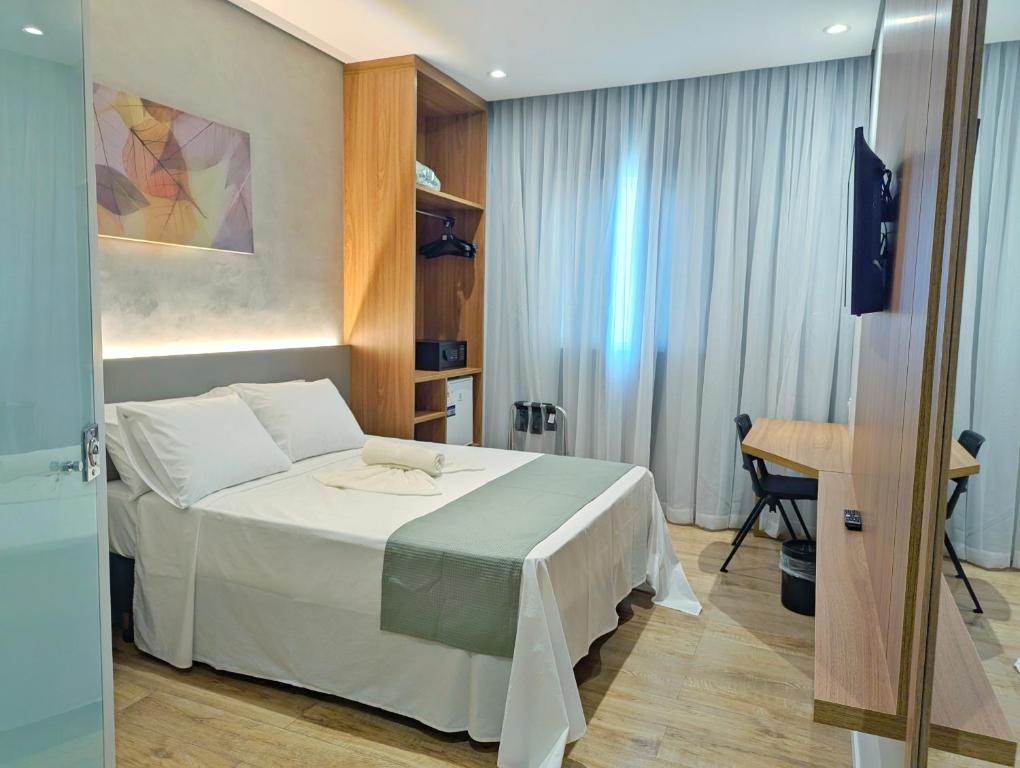 Postel nebo postele na pokoji v ubytování Hotel Jardim Iracema