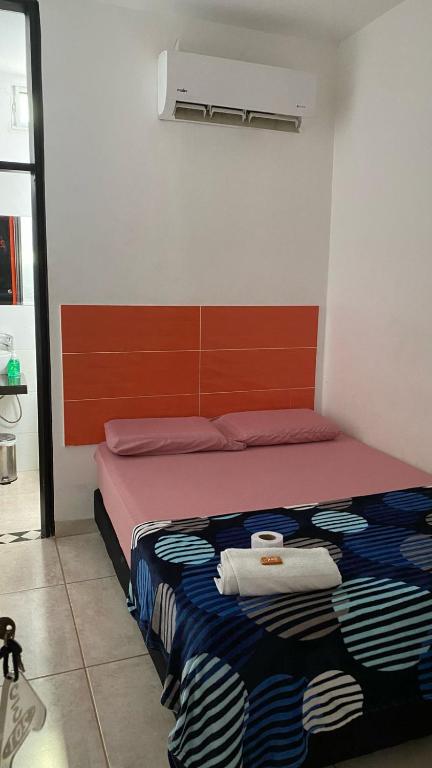 Postel nebo postele na pokoji v ubytování AVENTURa HOTEL