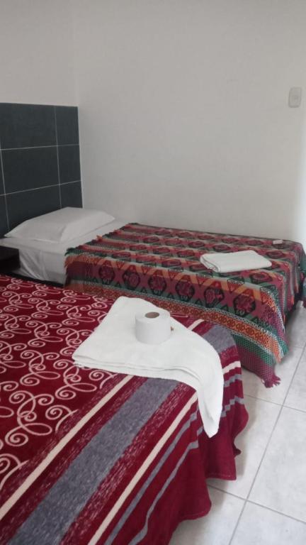 Postel nebo postele na pokoji v ubytování AVENTURa HOTEL