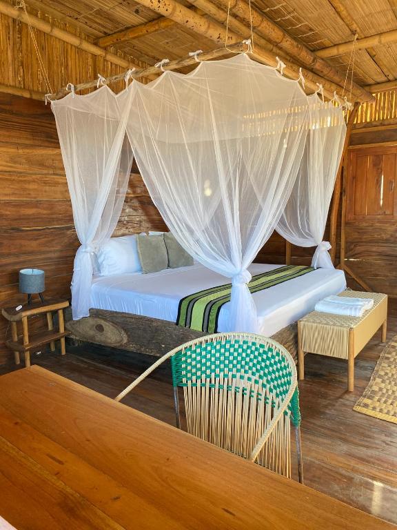 Postel nebo postele na pokoji v ubytování Palaa Mayapo Ecolodge