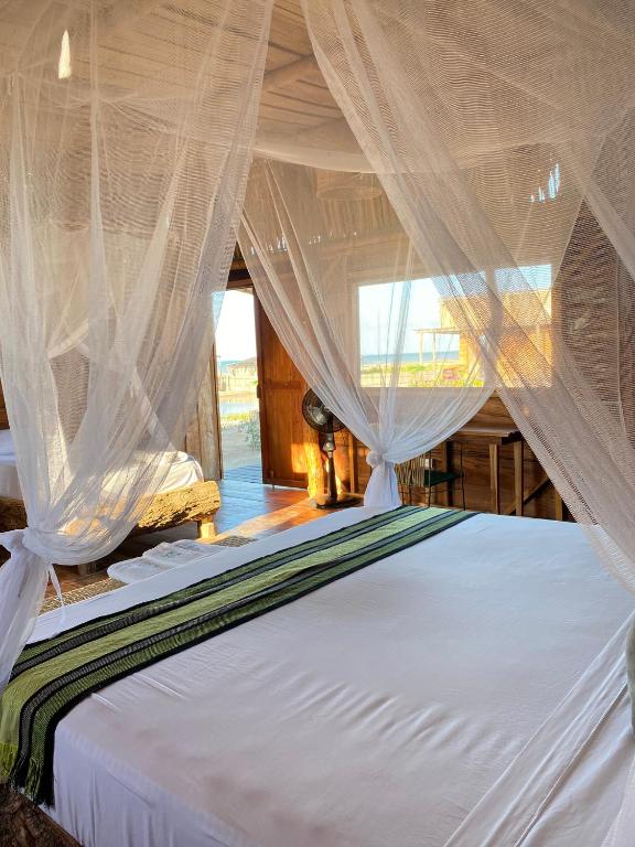 Postel nebo postele na pokoji v ubytování Palaa Mayapo Ecolodge