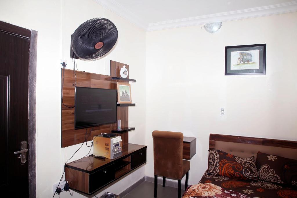 TV a/nebo společenská místnost v ubytování Sunshine Place S4